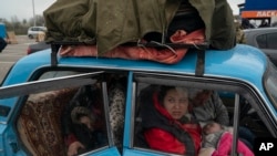 Internally displaced people from Mariupol and nearby towns fleeing from the Russian attacks, arrive at a refugee center , in Zaporizhzhia, Ukraine, April 21, 2022.