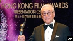 FILE - Hong Kong actor Kenneth Tsang poses after winning the Best Supporting Actor award for his movie 'Overhead 3' during the Hong Kong Film Awards in Hong Kong, Apr. 19, 2015. 