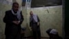 FILE - Hazara men pray inside a Shiite shrine in Kabul, Afghanistan, Nov. 5, 2021.