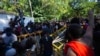 Sri Lankan university students push down police barricades during a protest over the country’s worst economic crisis in decades outside the residence of prime minister Mahinda Rajapaksa in Colombo, Sri Lanka, April 24, 2022.