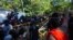 Sri Lankan university students push down police barricades during a protest over the country’s worst economic crisis in decades outside the residence of prime minister Mahinda Rajapaksa in Colombo, Sri Lanka, April 24, 2022.