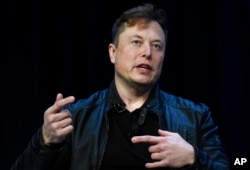 FILE - Tesla and SpaceX CEO Elon Musk speaks at a conference in Washington on March 9, 2020.