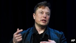 FILE -Tesla and SpaceX Chief Executive Officer Elon Musk speaks at a conference in Washington, March 9, 2020.
