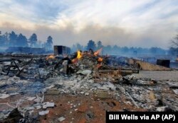 FILE - A home on the outskirts of Flagstaff, Ariz., was destroyed by a wildfire on Tuesday, April 19, 2022. Photo provided April 20, 2022.