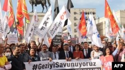 Demonstrators carrying the banner "We are defending Gezi" gather in Ulus Square to protest the prison sentence given to the civil society leader Osman Kavala by the Turkish courts, in Ankara, April 26 2022.