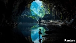 Nguyen Ngoc Anh, 36, who was an illegal logger turned forest protector poses at Phong Nha National Park, Quang Binh province, April 8, 2022. (REUTERS/Hoang Trung)