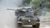 FILE - A German Gepard antiaircraft tank fires during a demonstration about 80 km south east of Hamburg, Germany, June 20, 2007. Germany will authorize the delivery of tanks to Ukraine, Defense Minister Christine Lambrecht said on April 26, 2022.