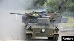 FILE - A German Gepard antiaircraft tank fires during a demonstration about 80 km south east of Hamburg, Germany, June 20, 2007. Germany will authorize the delivery of tanks to Ukraine, Defense Minister Christine Lambrecht said on April 26, 2022.