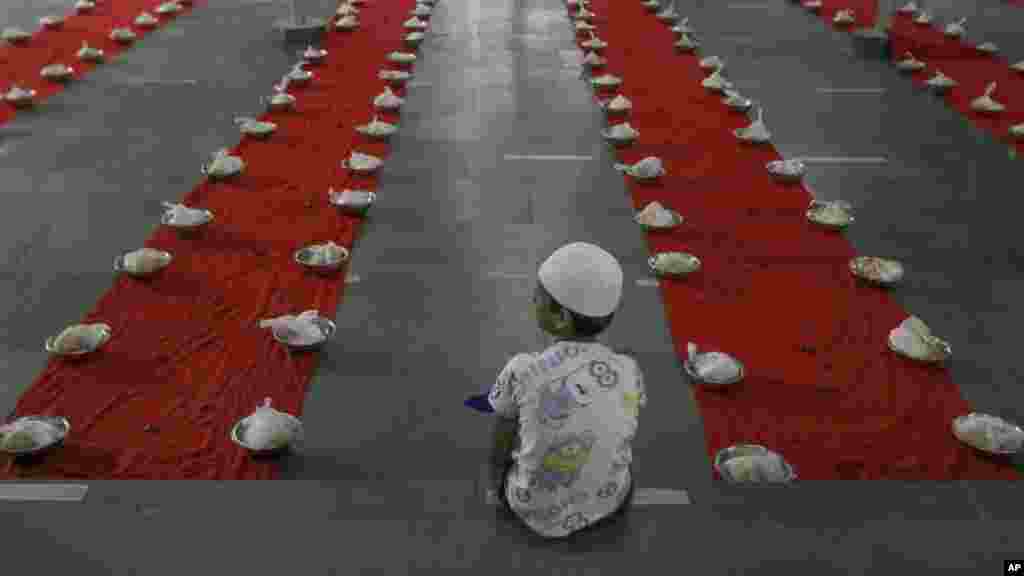 A Muslim boy waits to break his day-long fast during Ramadan in Hyderabad, India.