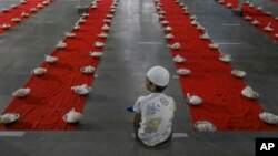 A Muslim boy waits to break his day-long fast during Ramadan in Hyderabad, India.