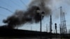 Smoke rises following a military strike on a facility near the railway station, amid Russia's invasion of Ukraine, in the frontline city of Lyman, Donetsk region, Apr. 28, 2022. 