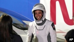 NASA Mission specialist Jessica Watkins smiles as she talks to family members after leaving the Operations and Checkout building for a trip to Launch Complex 39-A, April 27, 2022, at the Kennedy Space Center in Cape Canaveral, Florida.