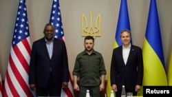 Ukraine's President Volodymyr Zelenskyy poses for a picture with U.S. Secretary of State Antony Blinken and U.S. Defense Secretary Lloyd Austin before a meeting, as Russia's attack on Ukraine continues, in Kyiv, Ukraine April 24, 2022. (Ukrainian Preside