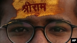 A devotee has the name of Hindu god Rama written on his forehead during a religious procession to celebrate Ram Navami, a Hindu festival marking the birth anniversary of Lord Ram, in Hyderabad, India, April 10, 2022.