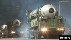 Hwasong-17 intercontinental ballistic missiles are shown in a nighttime military parade in Pyongyang, North Korea, in this undated photo released by North Korea's Korean Central News Agency (KCNA) on April 26, 2022. 