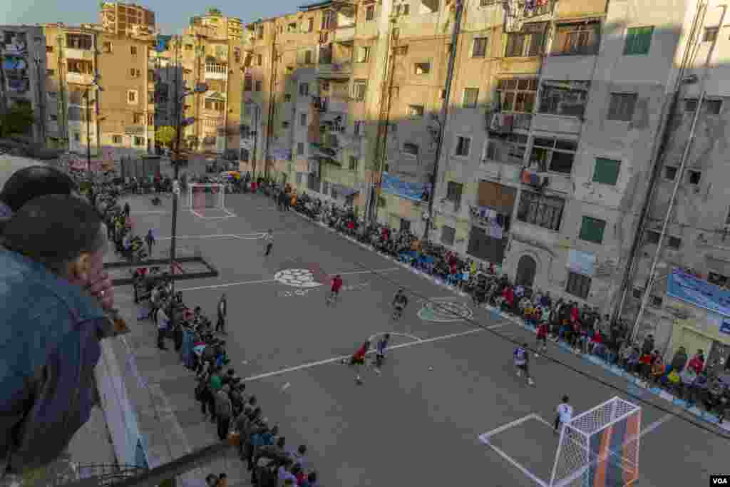 Hundreds gather for an annual Ramadan football tournament following a two-year suspension due to the pandemic, in Alexandria, April 15, 2022. (H. Elrasam/VOA)