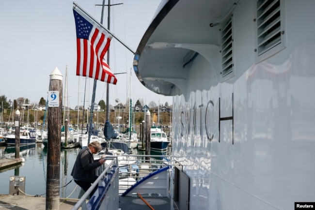 All American Marine project manager Matt Riedel disembarks the Sea Change while it is docked at Squalicum Harbor in Bellingham, Washington, U.S., April 7, 2022. (REUTERS/Matt Mills McKnight)