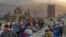 Friends and colleagues gather at a restaurant to break their daylong fast with an Iftar meal in downtown Cairo, April 24, 2022. (H. Elrasam/VOA)
