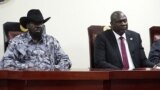 FILE - South Sudanese President Salva Kiir (L), and opposition leader Riek Machar attend the signing ceremony after the two leaders sealed an agreement on a key military provision of their faltering peace deal at the State house in Juba, April 3, 2022.