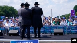 FILE - People attend the "NO FEAR: Rally in Solidarity with the Jewish People" event in Washington, July 11, 2021.