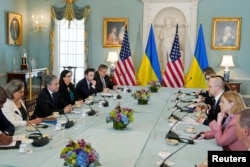 Ukrainian Prime Minister Denys Shmyhal, center right, and U.S. Secretary of State Antony Blinken, second from left, attend a meeting at State Department, amid Russia's invasion of Ukraine, in Washington, April 22, 2022.