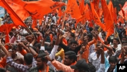 Hindus participate in a religious procession to mark the Hanuman Jayanti festival in Hyderabad, India, April 16, 2022.