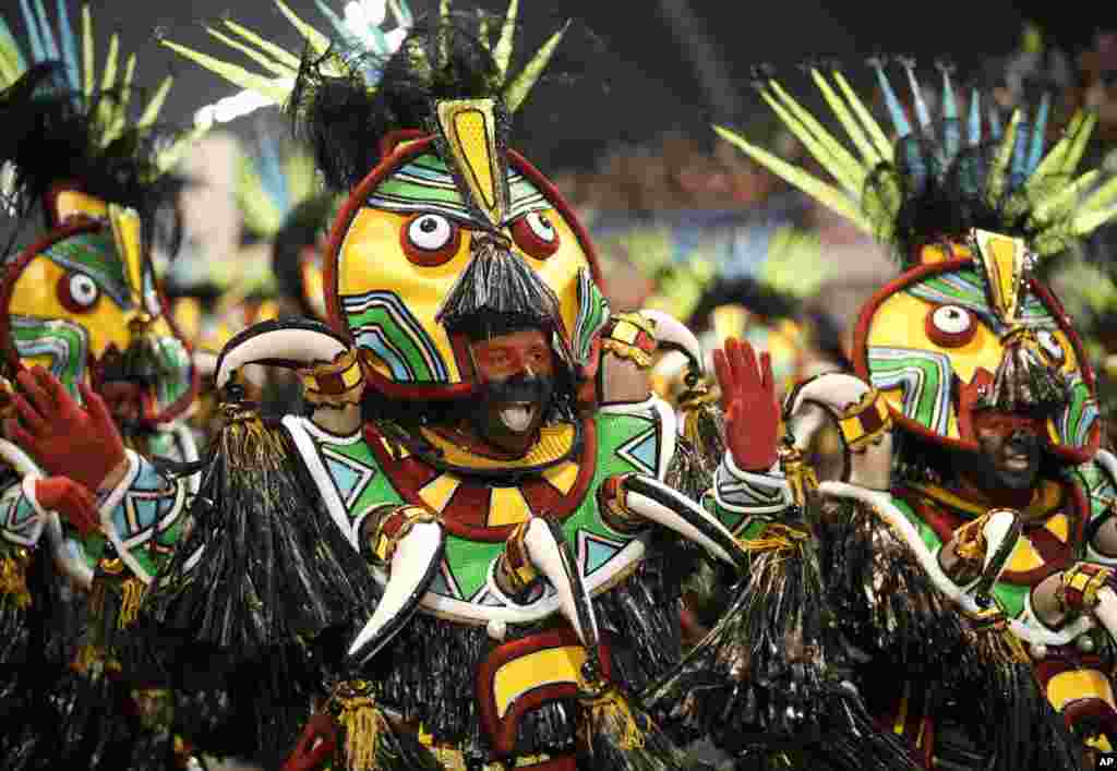 Dancers from the Rosas de Ouro samba school perform during a carnival parade in Sao Paulo, Brazil.