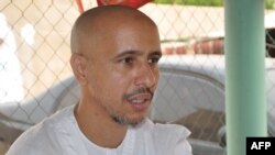 FILE - Mohamedou Ould Slahi, a Guantanamo Bay prisoner who wrote a best-selling book about his experiences in the military prison, poses on Oct. 18, 2016 after he was reunited with his family in Mauritania on Oct. 17 after 14 years of detention.
