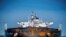 Members of Greenpeace sail next to a tanker "Ust Luga" as part of a protest against delivering Russian oil to Norway, amid Russia's invasion of Ukraine, according to Greenpeace, near Asgardstrand, Norway, April 25, 2022.