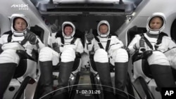 This file photo provided by SpaceX shows the AXIOM crew seated in the Dragon spacecraft on Friday, April 8, 2022, in Cape Canaveral, Fla. (SpaceX via AP, File)