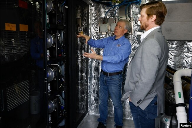 Switch Maritime CEO Pace Ralli sits inside the cabin of the Sea Change, a 70-foot, 75 passenger ferry, that is propelled entirely by hydrogen fuel cells, in Bellingham, Washington, U.S., April 7, 2022. (REUTERS/Matt Mills McKnight)