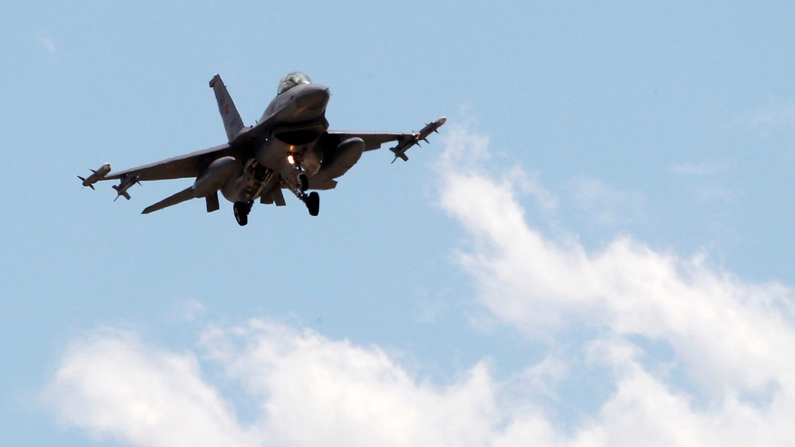 FILE - A Turkish F-16 fighter jet approaches Incirlik Air Base in Adana, Turkey, July 3, 2012. Greece has blocked Turkey from joining an upcoming NATO exercise because of what Athens says is a record number of airspace violations by armed Turkish jets.