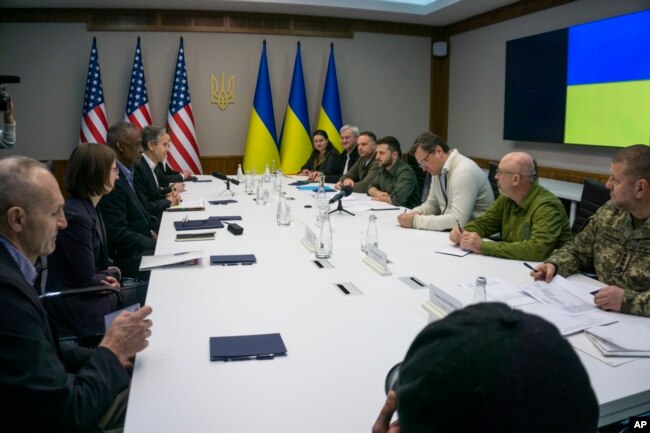 In this image provided by the Department of Defense, Secretary of Defense Lloyd Austin, third from left, and Secretary of State Antony Blinken, right, meet with Ukrainian Foreign Minister Dmytro Kuleba, third from right and Ukrainian President Volodymyr Zelenskyy on April 24, 2022 in Kyiv, Ukraine. (Department of Defense via AP)