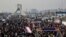 FILE -- Iranians attend an annual rally commemorating the anniversary of the 1979 Islamic revolution, on Azadi (Freedom) Street, while the Azadi tower is seen at rear left, in Tehran, Iran, Feb. 11, 2014. 