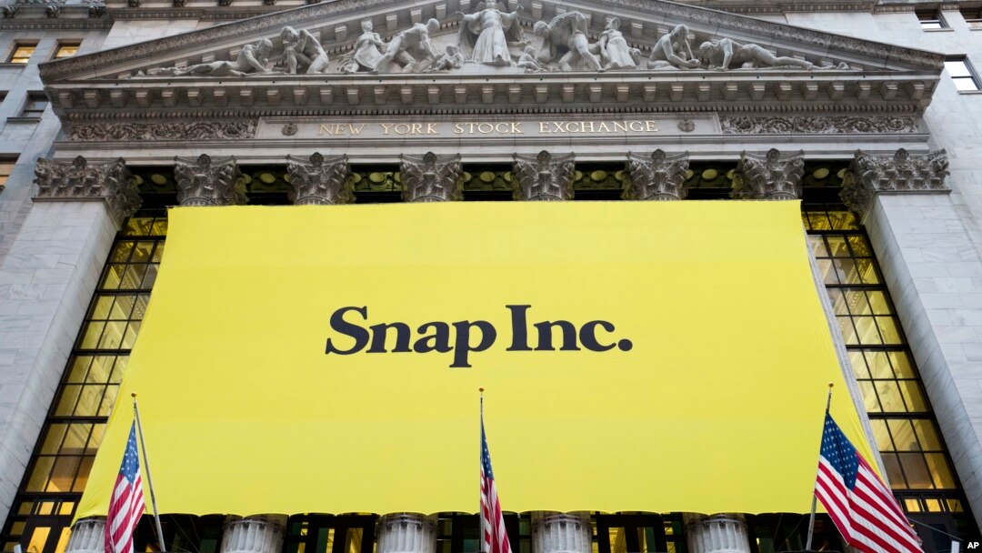 A banner for Snap Inc. hangs from the front of the New York Stock Exchange, March 2, 2017, in New York. 