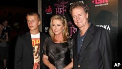 FILE - Conrad Hilton, left, Kathy Hilton, center, and Rick Hilton arrive at the launch party of new MTV series "Paris Hilton's My New BFF" in Los Angeles. 