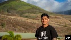 TJ Rickard, Lahainaluna High School boys basketball coach, poses for a portrait at Lahainaluna High School in Lahaina on the island of Maui in Hawaii, Nov. 18, 2024. 