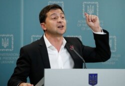 FILE - Ukrainian President Volodymyr Zelenskiy speaks during a news conference in Kyiv, Ukraine, Oct. 1, 2019.