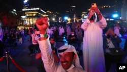 Emiratis celebrate after the Hope Probe enters Mars orbit as a part of Emirates Mars mission, in Dubai, United Arab Emirates, Feb. 9, 2021. 