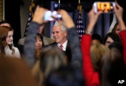 Vice President Mike Pence with his wife Karen Pence speaks to anti-abortion supporters and participants of the annual March for Life event, during a reception at the White House in Washington, Jan. 18, 2018.