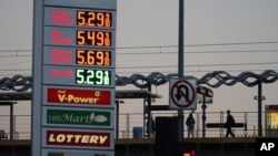 Gas prices are advertised at over five dollars a gallon, Feb. 28, 2022, in Los Angeles. 