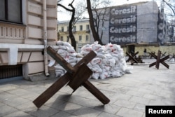 Anti-tank obstacles are placed on a pavement, following Russia's invasion of Ukraine, in Odessa, Ukraine, March 8, 2022.