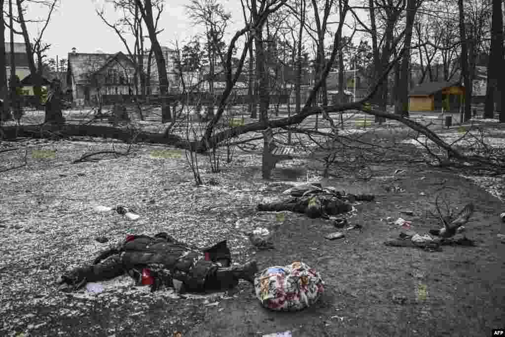 Bodies of civilians lie in a park in Irpin, north of Kyiv, March 10, 2022.