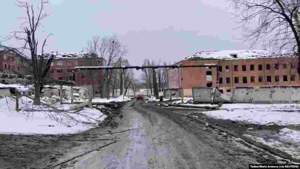 View of the damaged cadet corps building (R) and utility piping after Russian shelling in Kharkiv, March 8, 2022 in this still image from social media video.