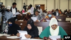 FILE - Somalia's members of Parliament attend a special assembly in which the president requested the abandonment of the two-year extension of his presidential term and immediate elections to ease a political crisis, in Mogadishu, May 1, 2021.