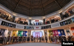 Customers queue to enter a Uniqlo store in Moscow, Russia, March 10, 2022.