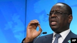 FILE - Senegal's President Macky Sall speaks during a media conference at the conclusion of an EU Africa summit in Brussels, Feb. 18, 2022.