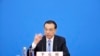 中国总理李克强在北京人大会堂全国人大会议闭幕后举行的记者会上讲话的照片。（2022年3月11日）
