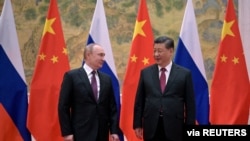 中国国家主席习近平在北京会晤到访的俄罗斯总统普京。（2022年2月4日）