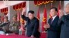 FILE - In an image made from video, North Korean leader Kim Jong Un, center, and Liu Yunshan, China's Communist Party's No. 5 leader, second right, waves during a ceremony to mark the 70th anniversary of the country's ruling party, in Pyongyang, Oct. 10, 